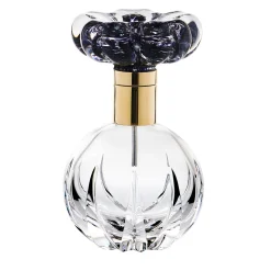 Bottiglia di profumo Cistus con fiore nero