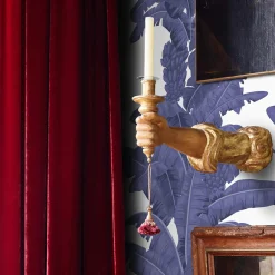 Carta da parati blu con foglie tropicali