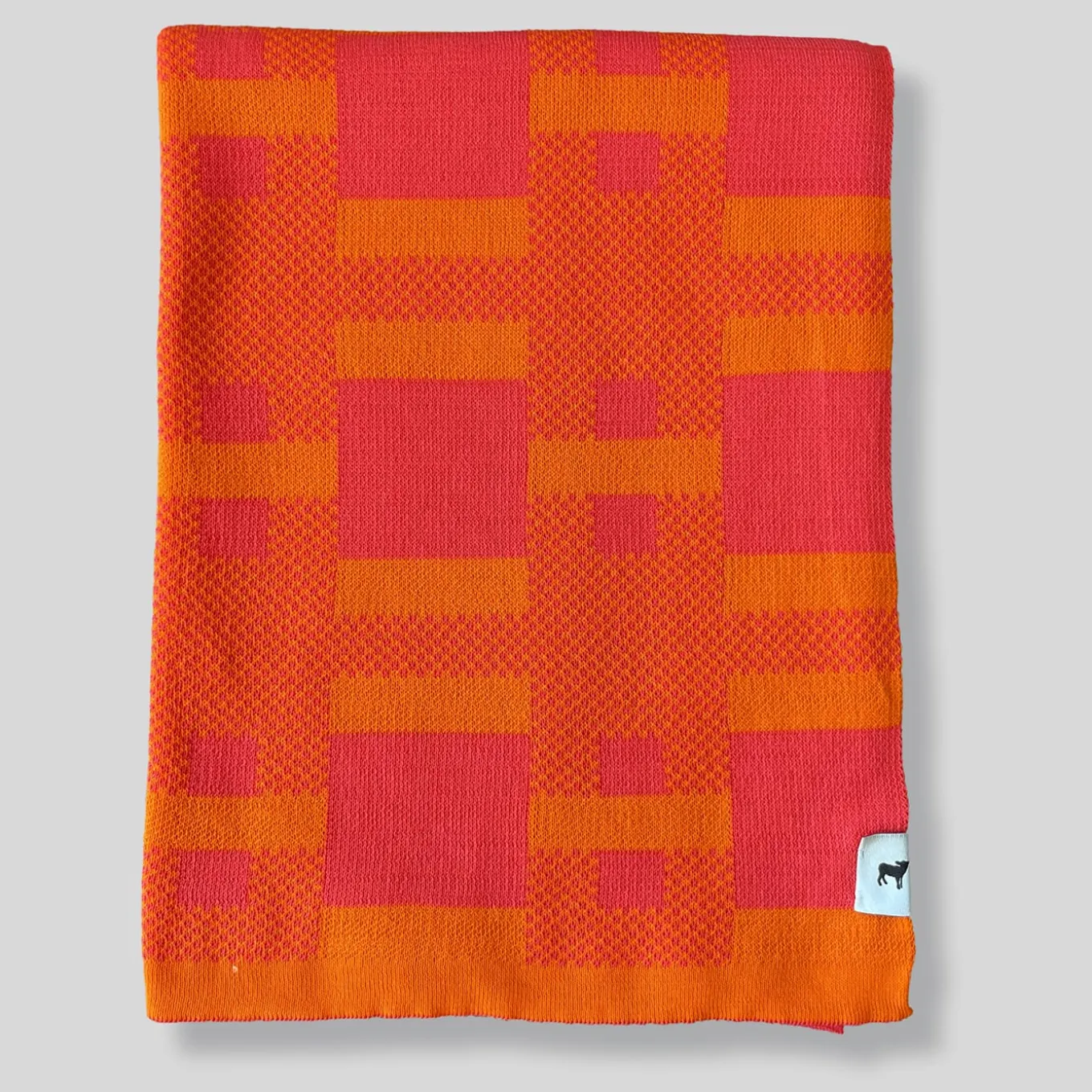 Coperta arancione Plusminus Bio di Angela Lorenz