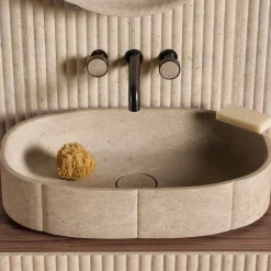 Lavabo con top in marmo ovale beige sartoriale