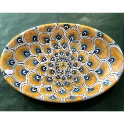 Piatto ovale con piume di pavone giallo