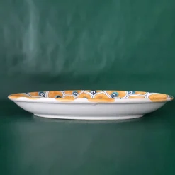 Piatto ovale con piume di pavone giallo