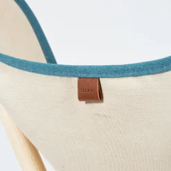 Poltrona Tripolina in crema e blu teal