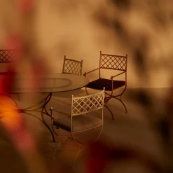 Tavolo ovale in vetro e ferro battuto Solivo