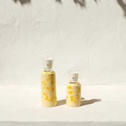 Totem crema e giallo con candela profumata Agrumeto